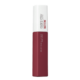 Un tube de rouge à lèvres Maybelline New York Superstay Matte Ink Ruler 80, d'une teinte rouge intense rappelant un coucher de soleil à Dakar, avec un bouchon blanc affichant le nom du produit. La partie inférieure du tube correspond parfaitement à la couleur vibrante du rouge à lèvres. Dakar