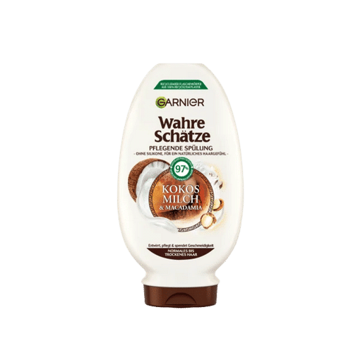 Garnier Ultra Doux Après-Shampooing Nourrissant Lait de Coco et Macadamia Flacon de 250 ml avec texte Kokos Milch & Macadamia et étiquette d'ingrédients 97% naturels