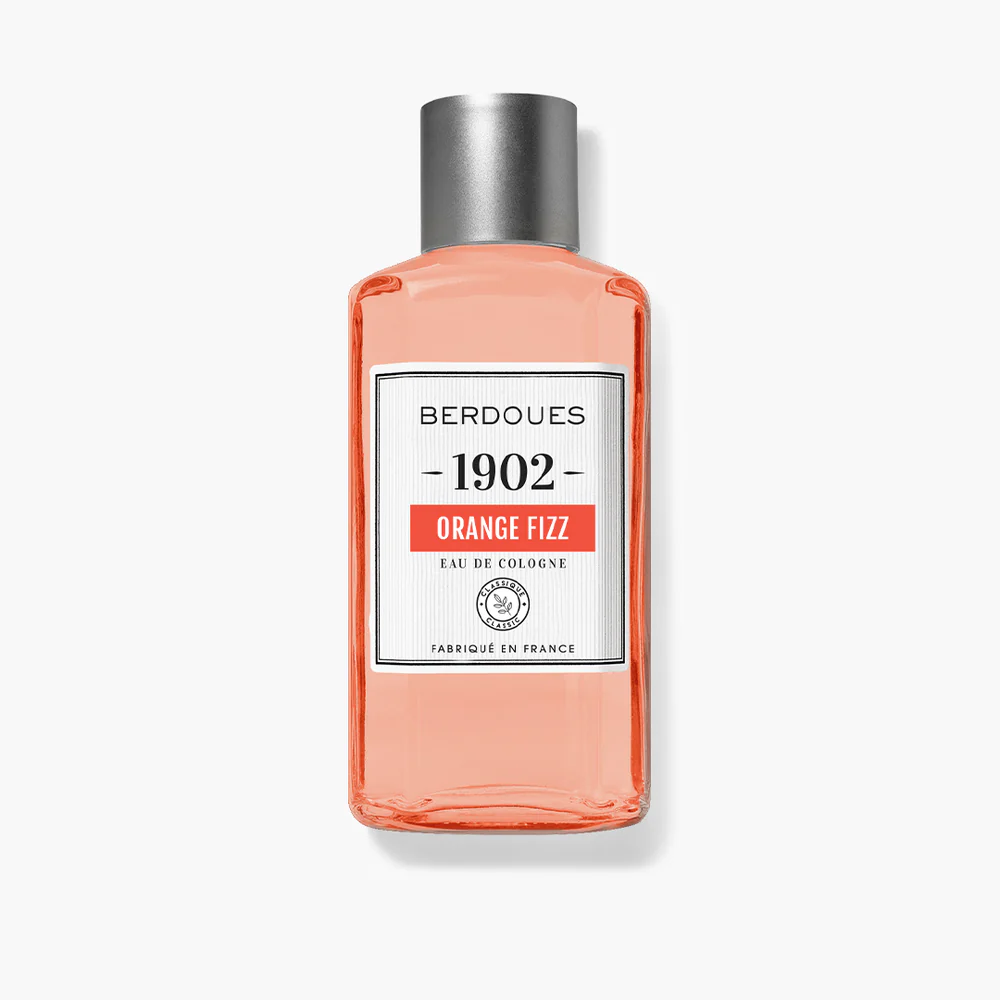 Un flacon de Berdoues Eau de Cologne Orange Fizz 125 ml doté d'un bouchon argenté et d'une étiquette transparente sur fond blanc