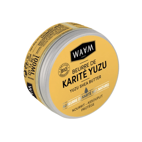 Un contenant rond de Waam Beurre de Karité Yuzu Corps