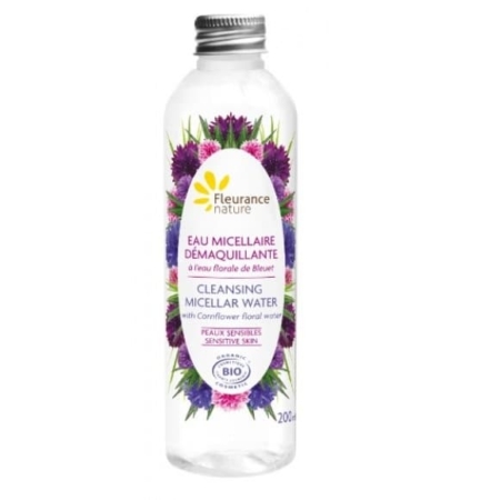 Découvrez Fleurance Nature Eau Micellaire Démaquillante à l'Eau Florale de Bleuet, un flacon transparent de 200 ml reflétant l'essence vibrante de Dakar. L'étiquette est ornée de fleurs violettes et roses et propose un texte en français et en anglais, spécialement conçu pour les peaux sensibles. Enrichie en eau florale de bleuet, cette eau micellaire insuffle une touche d'élégance sénégalaise dans votre routine de soins. Dakar