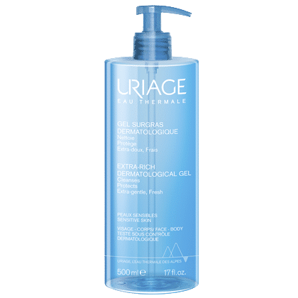 Un flacon bleu de Uriage Gel Douche Surgras Dermatologique Peaux Sensibles 500 ml avec une pompe