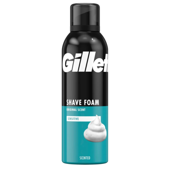 Une boîte de 200 ml de GILLETTE Mousse à raser Peau Sensible, présentant un design élégant noir et bleu sarcelle avec l'étiquette détaillant « Mousse à raser », « Parfum original » et « Peau Sensible », ainsi qu'une image de mousse blanche douce. Dakar