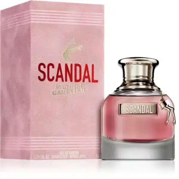 Un flacon « Jean Paul Gaultier Scandal Eau de Parfum pour femme 30 ml » repose élégamment à côté de son emballage rose chic. dakar