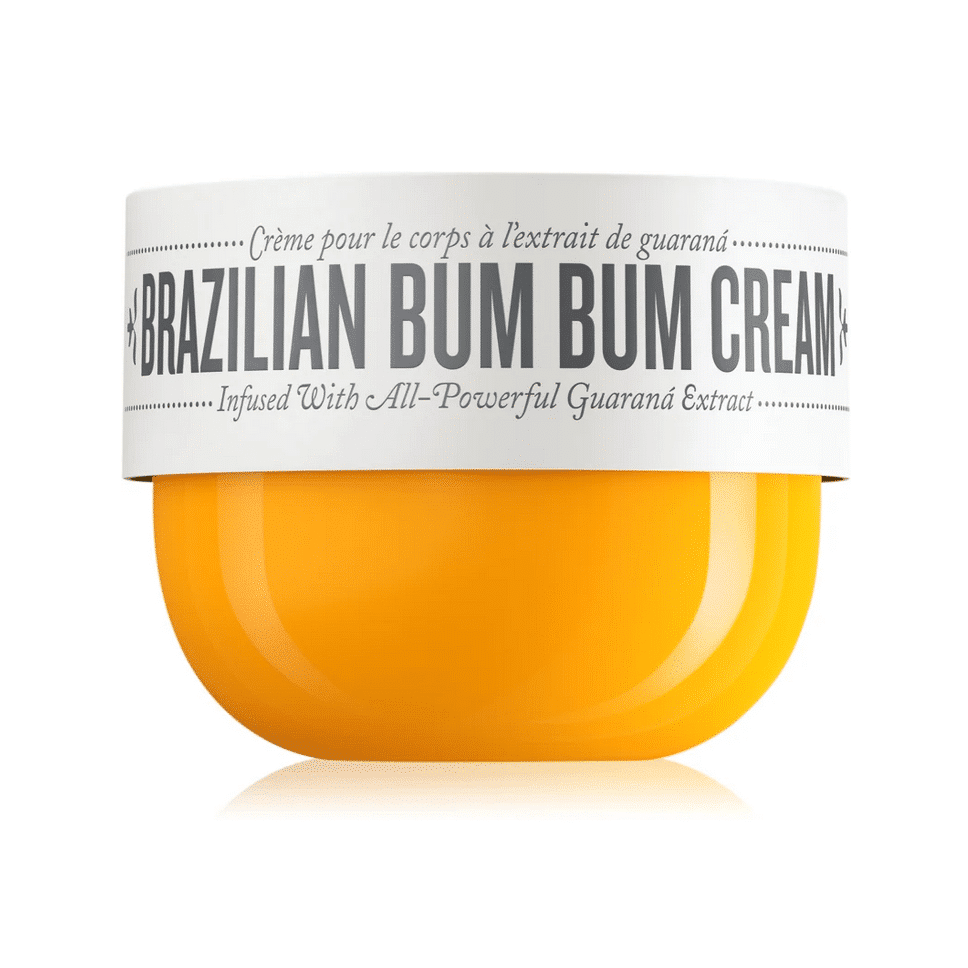 Un contenant jaune de Sol de Janeiro Brazil Bum Bum Cream crème raffermissante et lissante fesses et hanches 75 ml avec un capuchon et un texte blancs