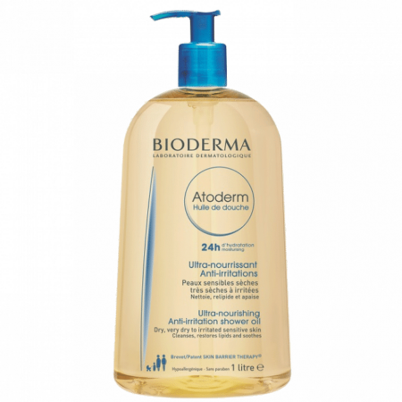 L'Huile De Douche Bioderma ATODERM 1L est un flacon transparent avec pompe bleue disponible à Dakar. L'étiquette affiche un texte en français et en anglais, soulignant ses bienfaits ultra-nourrissants et anti-irritants pour les peaux très sèches et sensibles. Dakar