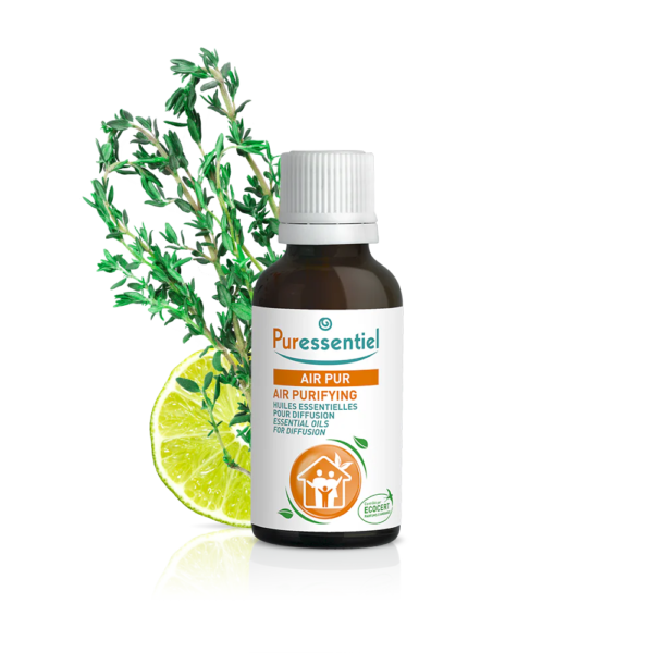 Puressentiel Huile Essentielle Menthe Poivrée BIO Flacon de 30 ml (Copie) avec tranche de citron vert et feuillage en fond.