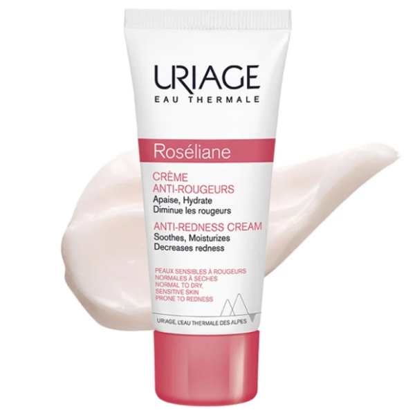 Tube de URIAGE Roseliane Crème Anti Rougeurs 40 ml sur fond blanc avec un tourbillon de crème à côté.