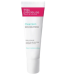 Un tube d'Eau Précieuse Clearskin SOS Boutons 10 ml est présenté. L'emballage est blanc avec un texte rouge et vert, soulignant son adéquation aux peaux à tendance acnéique et sa conception pour atténuer les imperfections pendant la nuit. Dakar