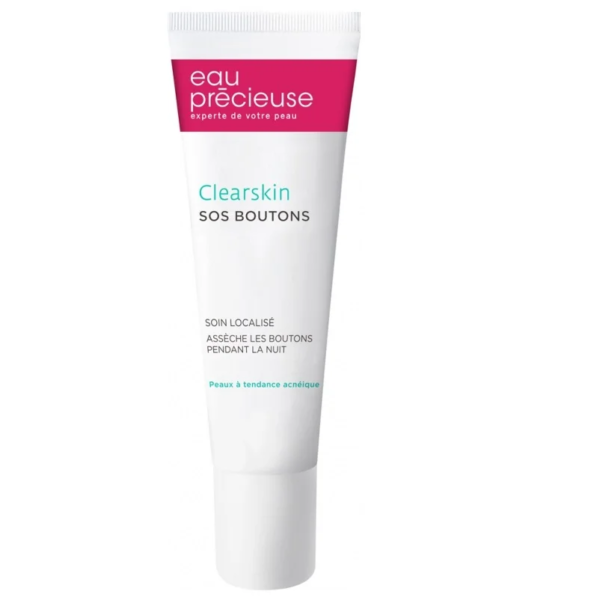 Un tube d'Eau Précieuse Clearskin SOS Boutons 10 ml est présenté. L'emballage est blanc avec un texte rouge et vert, soulignant son adéquation aux peaux à tendance acnéique et sa conception pour atténuer les imperfections pendant la nuit. Dakar